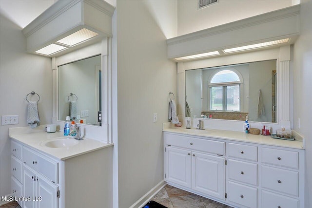 full bathroom featuring two vanities