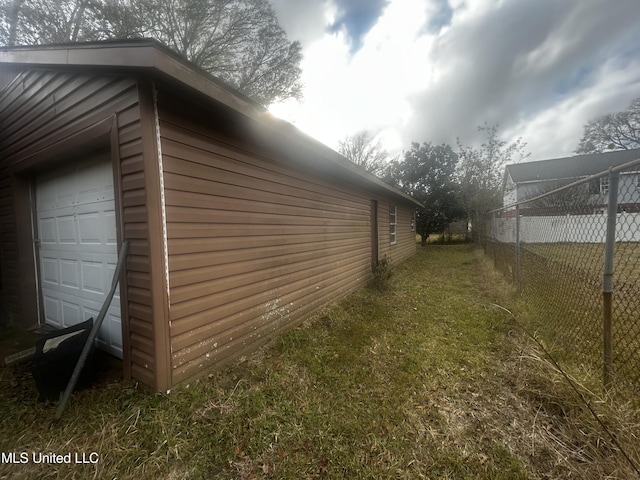 view of side of property with a lawn