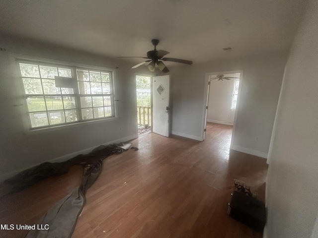 empty room featuring ceiling fan and wood-type flooring