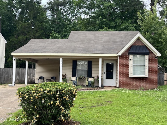 view of front of home with a carport, driveway, and covered porch
