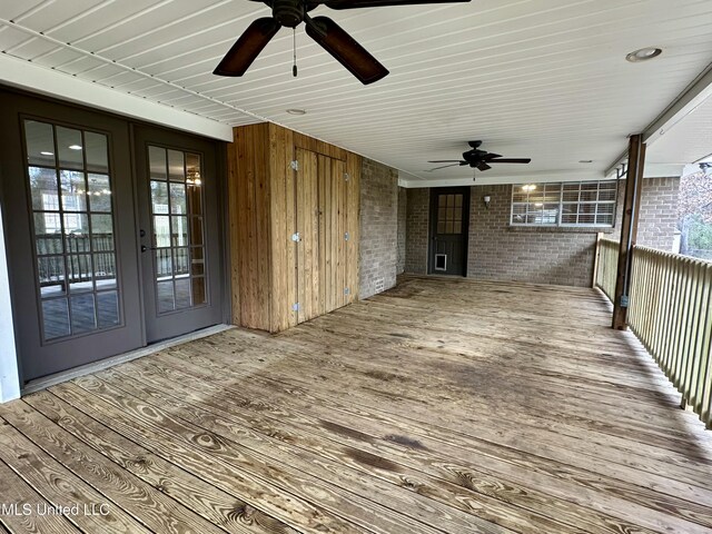 deck with ceiling fan and french doors