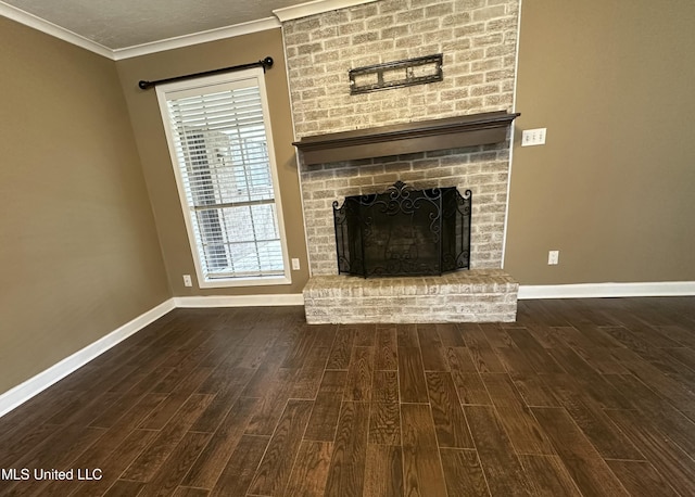 unfurnished living room featuring a fireplace, baseboards, wood finished floors, and ornamental molding