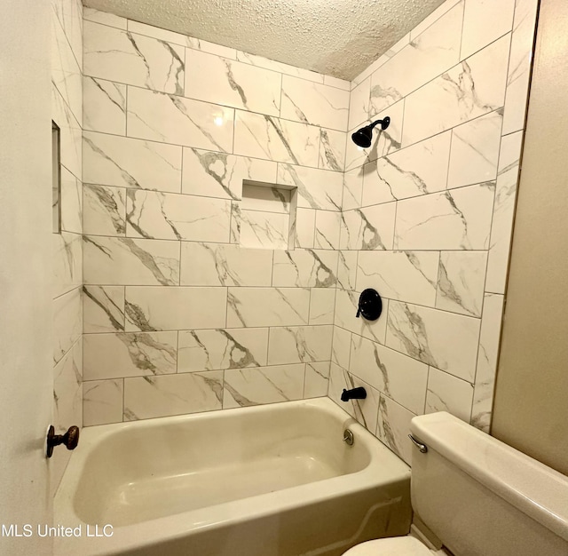 full bath featuring toilet, shower / washtub combination, and a textured ceiling