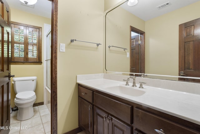 bathroom with toilet, baseboards, visible vents, tile patterned flooring, and vanity
