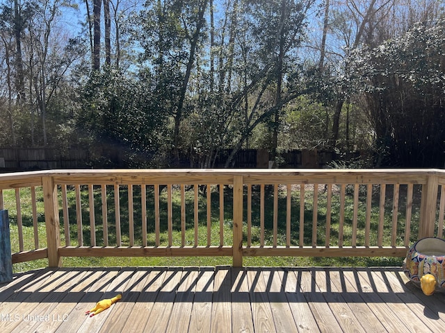 wooden deck featuring fence