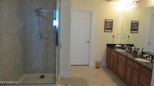 bathroom with vanity, tile patterned floors, and an enclosed shower