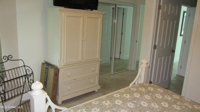 bedroom featuring light colored carpet