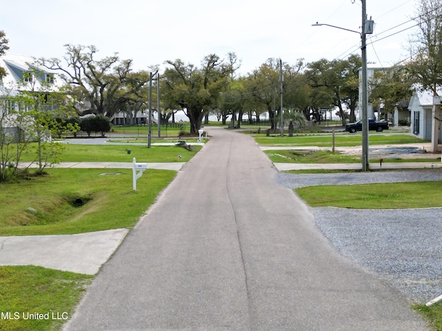 117 Bay Oaks Dr, Bay Saint Louis, MS 39520 - view of asphalt road with street lighting