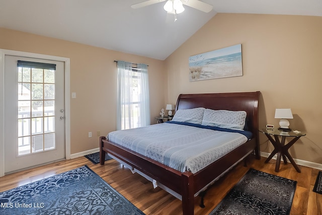 bedroom featuring hardwood / wood-style floors, vaulted ceiling, multiple windows, and ceiling fan