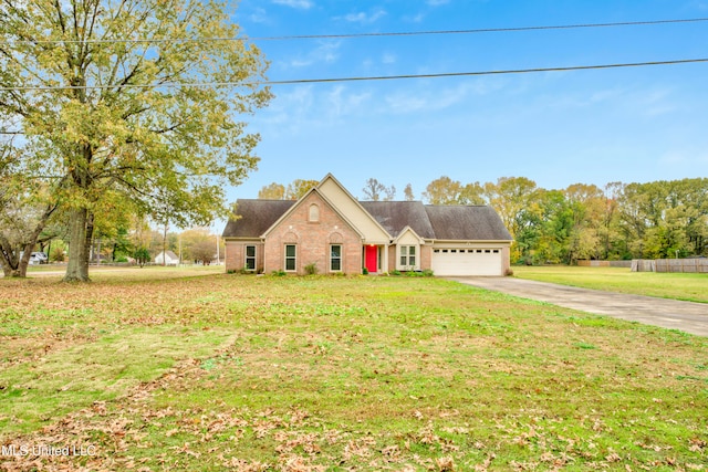 cape cod-style house featuring a garage and a front lawn