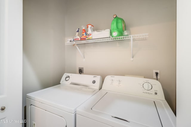 737 Ieke Cir, Diamondhead, MS 39525 - laundry area with washer and clothes dryer