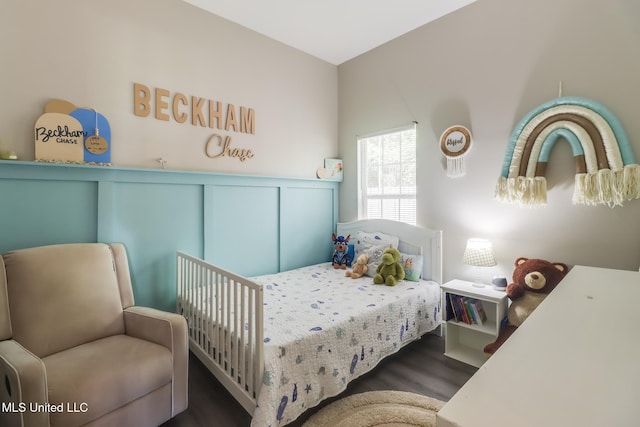 737 Ieke Cir, Diamondhead, MS 39525 - bedroom featuring wood finished floors and a wainscoted wall