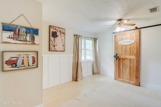 13120 Ridgeland Rd, Vancleave, MS 39565 - entrance foyer with ceiling fan and a barn door
