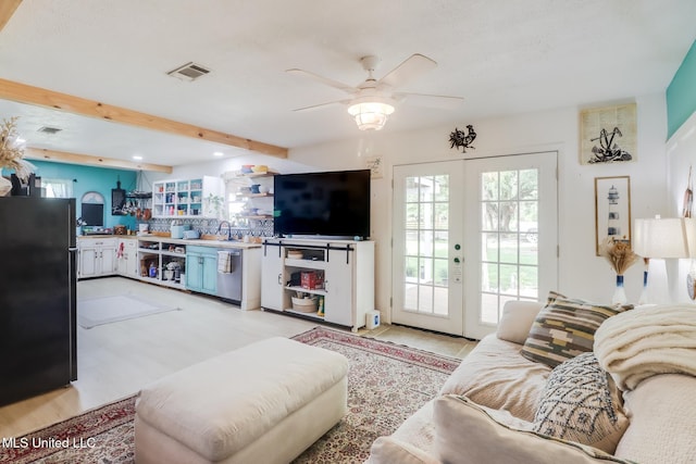 13120 Ridgeland Rd, Vancleave, MS 39565 - living room with french doors, ceiling fan, beamed ceiling, and recessed lighting