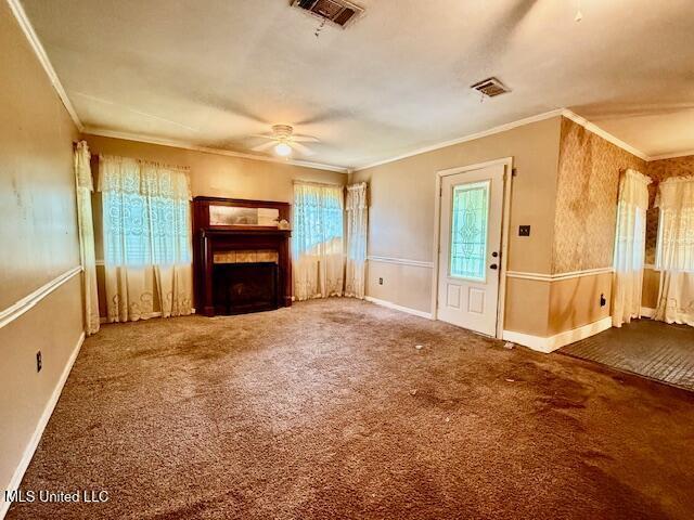 538 Will O Wisp Way, Jackson, MS 39204 - unfurnished living room with a ceiling fan, a fireplace, crown molding, carpet floors, and baseboards