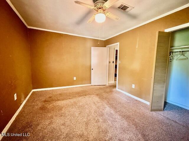 538 Will O Wisp Way, Jackson, MS 39204 - unfurnished bedroom with carpet, crown molding, baseboards, a closet, and a ceiling fan
