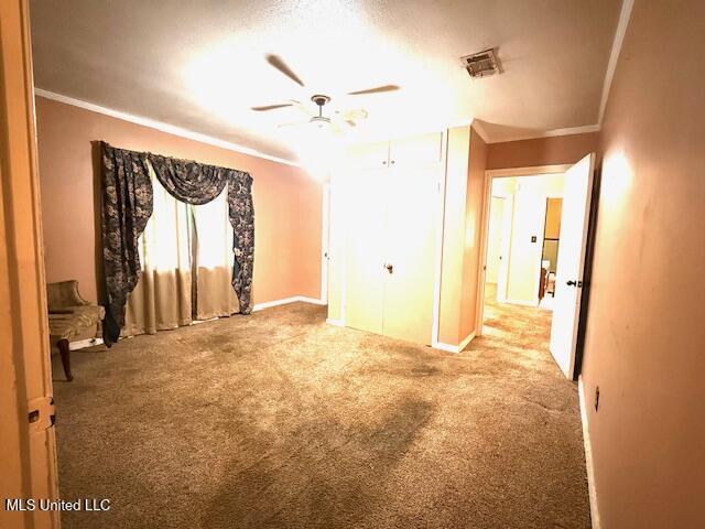 538 Will O Wisp Way, Jackson, MS 39204 - unfurnished bedroom featuring ornamental molding, carpet, baseboards, and ceiling fan