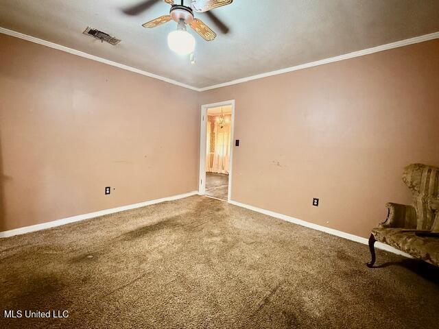 538 Will O Wisp Way, Jackson, MS 39204 - empty room with carpet flooring, baseboards, ornamental molding, and a ceiling fan