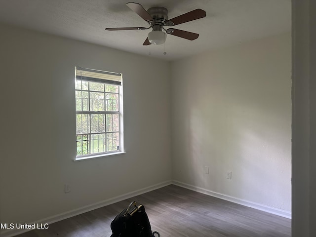 2806 Tara Rd, Jackson, MS 39212 - unfurnished room featuring dark wood finished floors, baseboards, and ceiling fan
