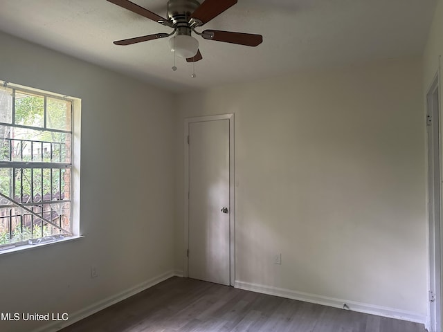 2806 Tara Rd, Jackson, MS 39212 - unfurnished room with wood finished floors, a ceiling fan, and baseboards