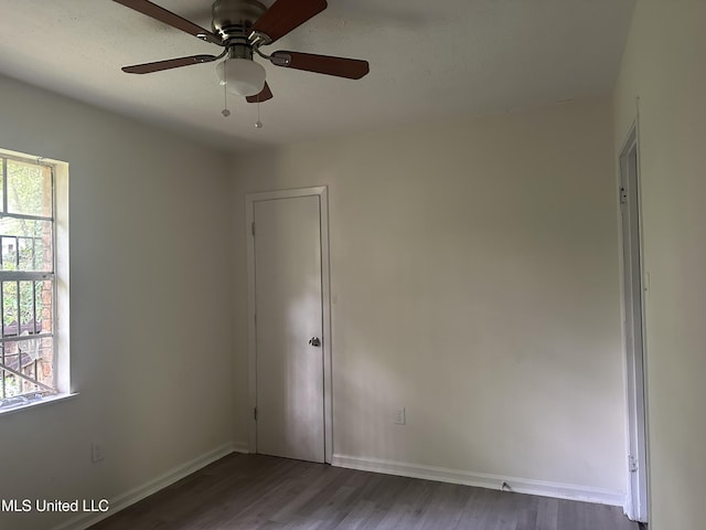 2806 Tara Rd, Jackson, MS 39212 - empty room with healthy amount of natural light, wood finished floors, a ceiling fan, and baseboards