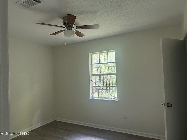 2806 Tara Rd, Jackson, MS 39212 - spare room with dark wood-type flooring, plenty of natural light, baseboards, and ceiling fan
