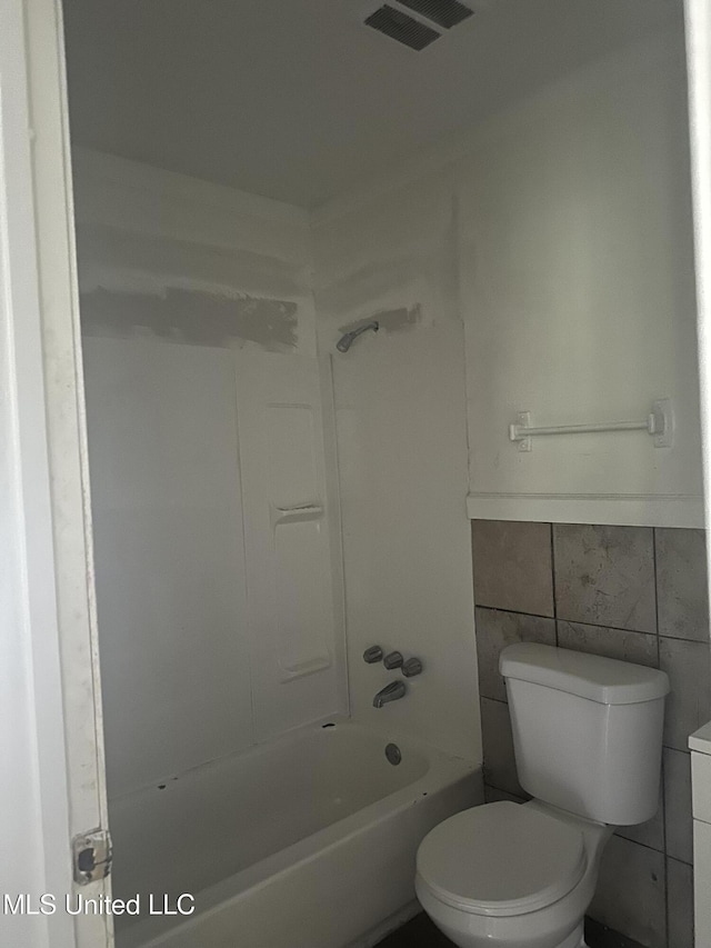 2806 Tara Rd, Jackson, MS 39212 - full bath featuring toilet, bathtub / shower combination, tile walls, and vanity