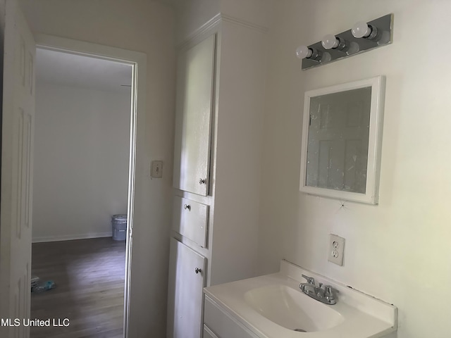 2806 Tara Rd, Jackson, MS 39212 - bathroom with vanity, wood finished floors, and baseboards
