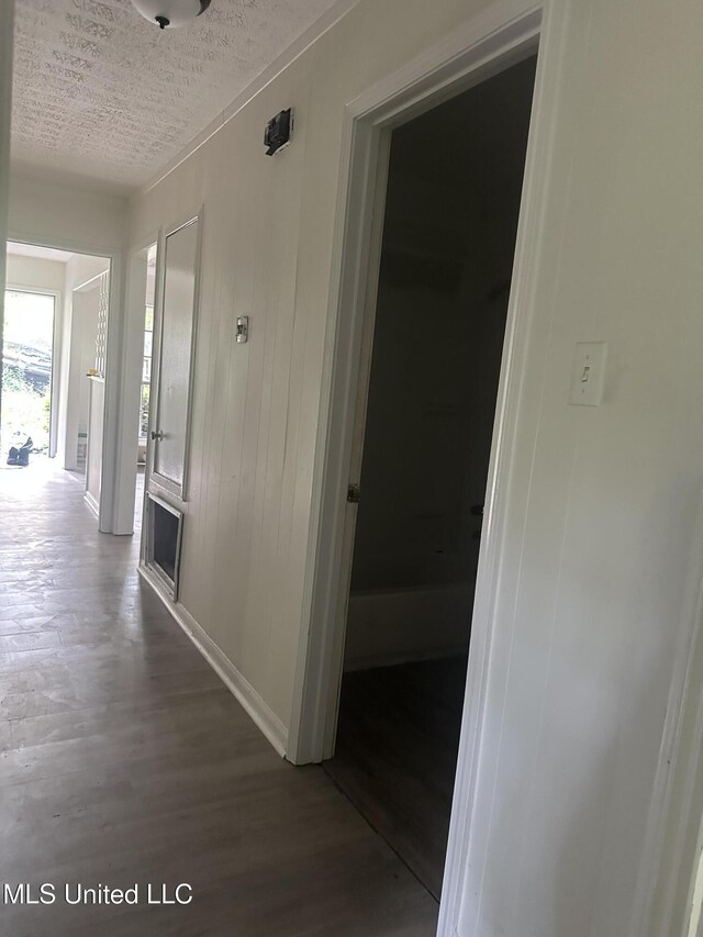 2806 Tara Rd, Jackson, MS 39212 - hall featuring wood finished floors, a textured ceiling, and baseboards