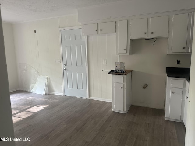 2806 Tara Rd, Jackson, MS 39212 - kitchen featuring dark wood-type flooring, crown molding, and baseboards