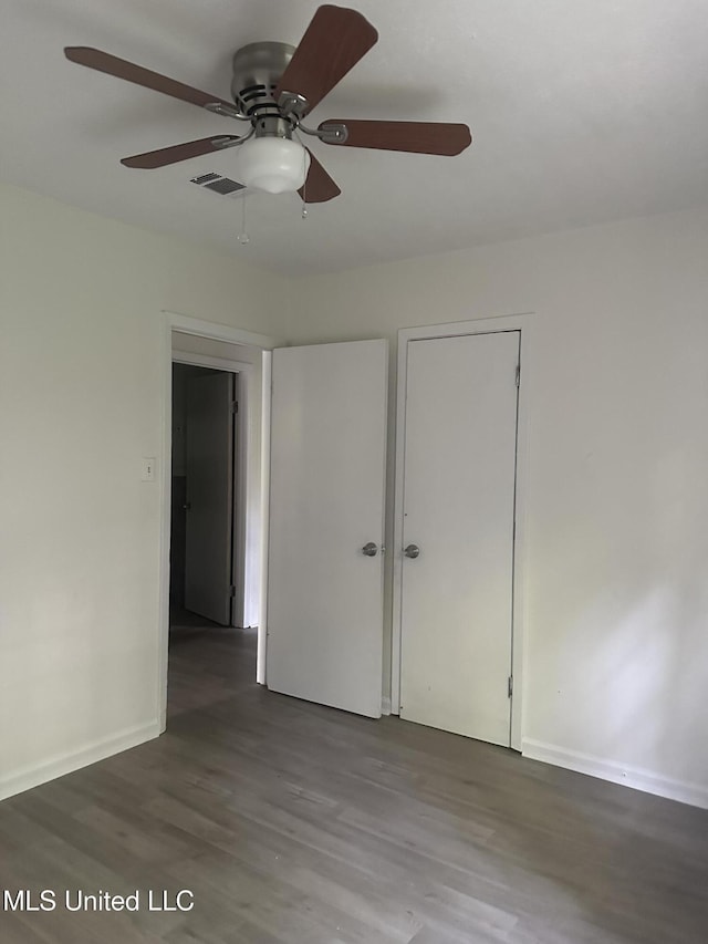 2806 Tara Rd, Jackson, MS 39212 - unfurnished bedroom featuring wood finished floors, baseboards, and a ceiling fan