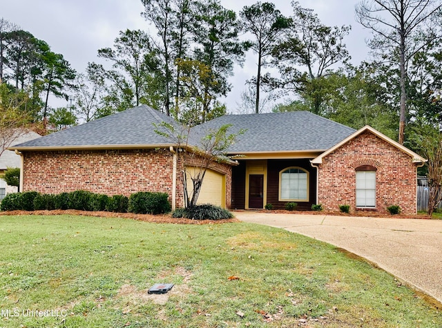 ranch-style house with a garage and a front yard