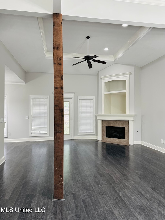 unfurnished living room with dark wood-type flooring, ceiling fan, and crown molding