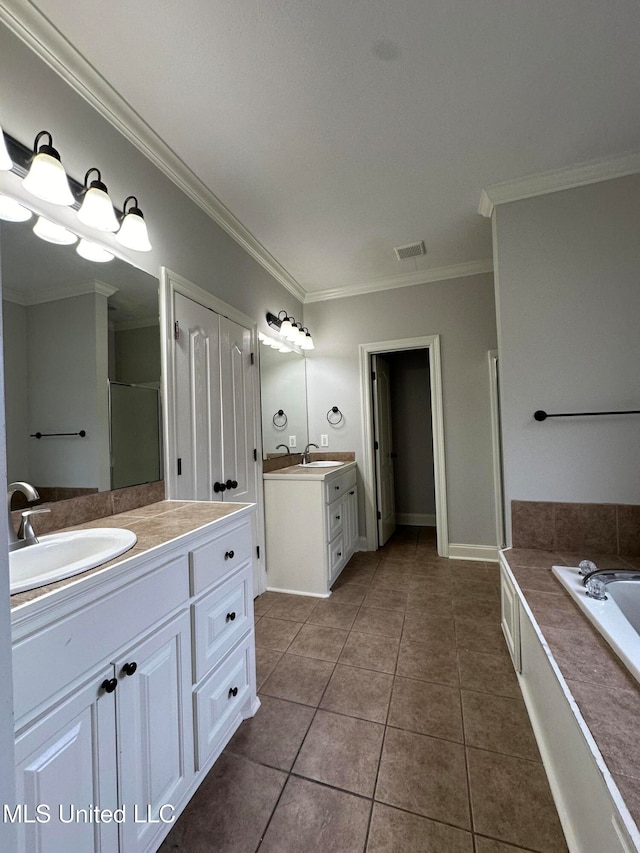 bathroom featuring ornamental molding, tile patterned flooring, shower with separate bathtub, and vanity