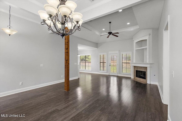 unfurnished living room featuring ceiling fan with notable chandelier, dark hardwood / wood-style flooring, and crown molding