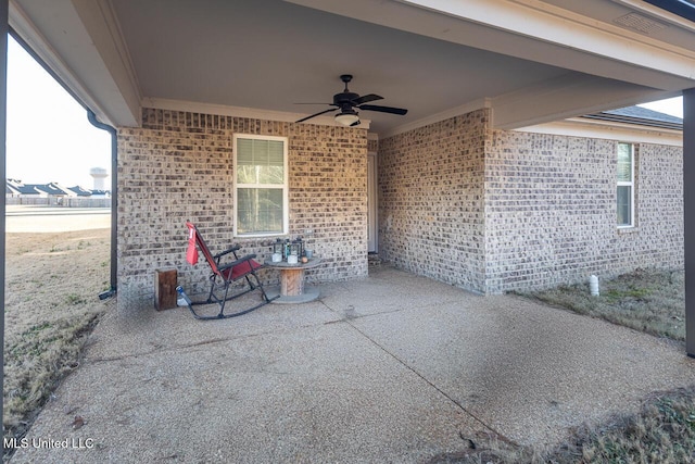 view of patio featuring ceiling fan