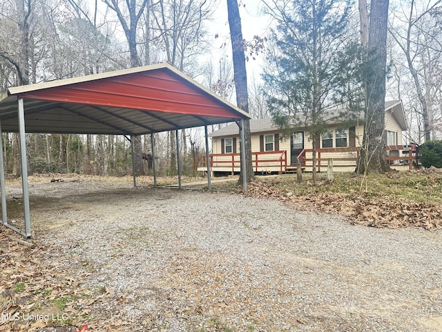52 Dog Wood Cove Rd, Coffeeville, MS 38922 - exterior space featuring a detached carport and driveway