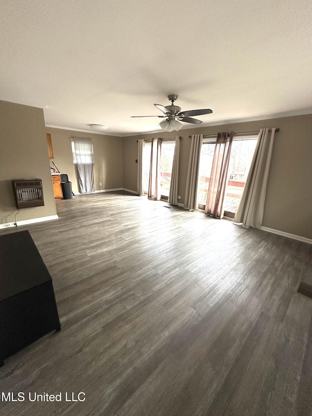 52 Dog Wood Cove Rd, Coffeeville, MS 38922 - unfurnished living room featuring heating unit, visible vents, baseboards, and dark wood finished floors