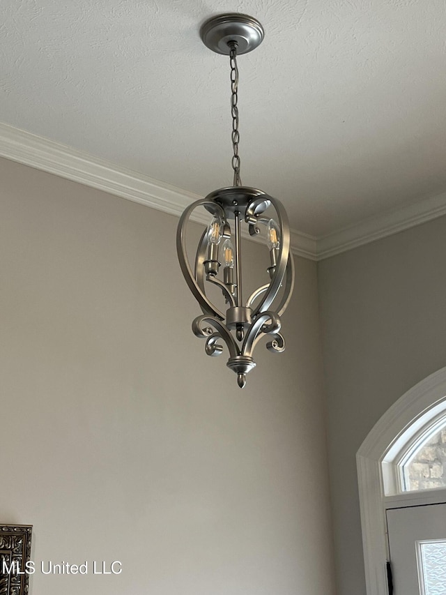 108 Brunswick Cv, Canton, MS 39046 - detailed view of a chandelier and ornamental molding