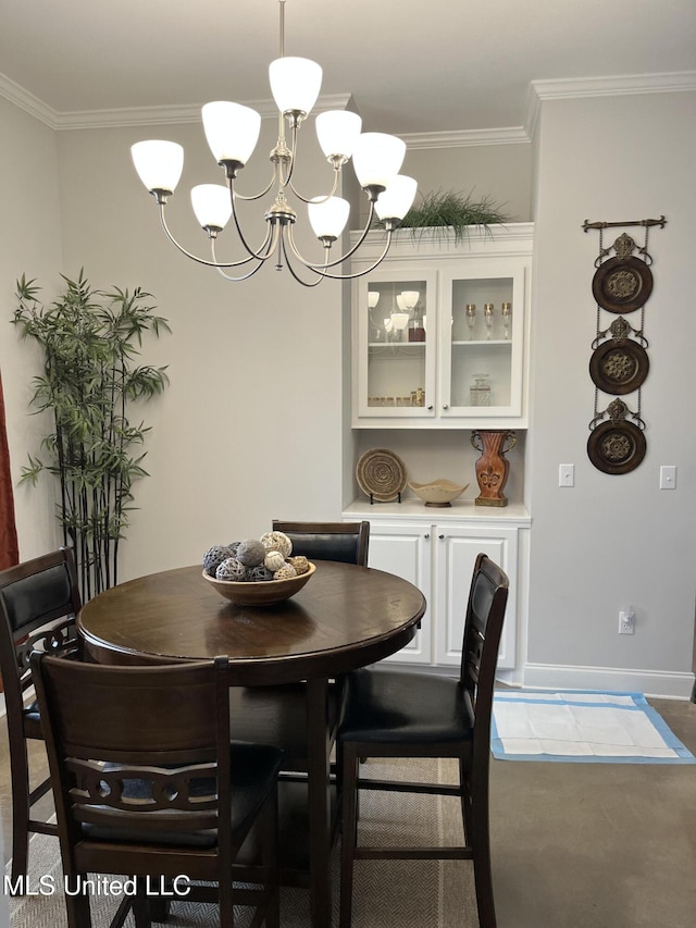 108 Brunswick Cv, Canton, MS 39046 - dining space featuring a chandelier, crown molding, and baseboards