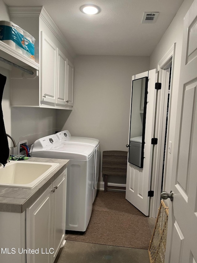 108 Brunswick Cv, Canton, MS 39046 - laundry room with cabinet space, independent washer and dryer, dark colored carpet, baseboards, and recessed lighting