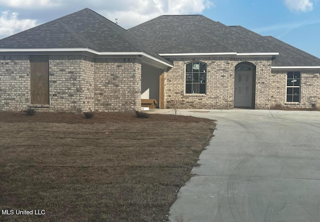 108 Brunswick Cv, Canton, MS 39046 - french country home featuring brick siding and a shingled roof