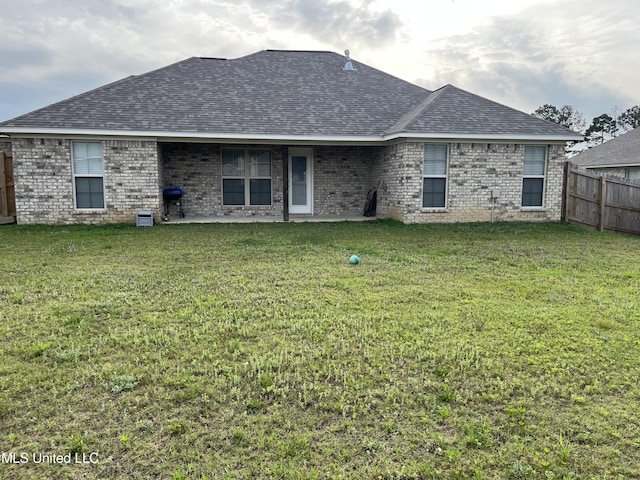 108 Brunswick Cv, Canton, MS 39046 - back of property featuring brick siding and roof with shingles