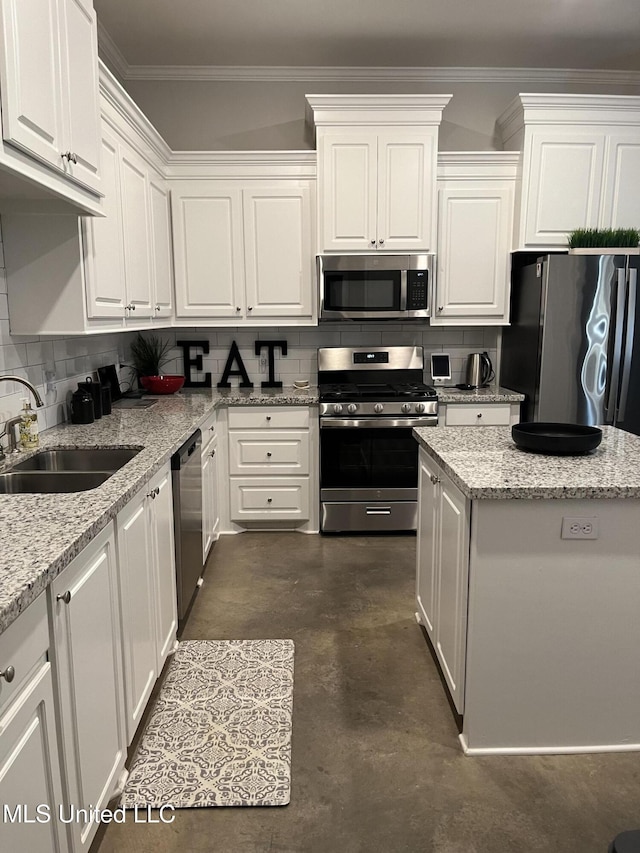 108 Brunswick Cv, Canton, MS 39046 - kitchen with appliances with stainless steel finishes, a sink, finished concrete flooring, white cabinets, and tasteful backsplash