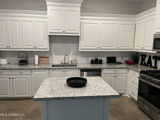 108 Brunswick Cv, Canton, MS 39046 - kitchen featuring a sink, appliances with stainless steel finishes, concrete floors, backsplash, and white cabinetry