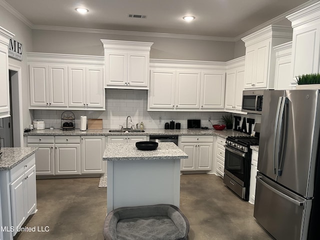108 Brunswick Cv, Canton, MS 39046 - kitchen with appliances with stainless steel finishes, finished concrete flooring, a sink, decorative backsplash, and crown molding
