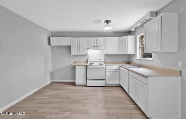 kitchen featuring light wood finished floors, under cabinet range hood, white electric range oven, white cabinetry, and baseboards
