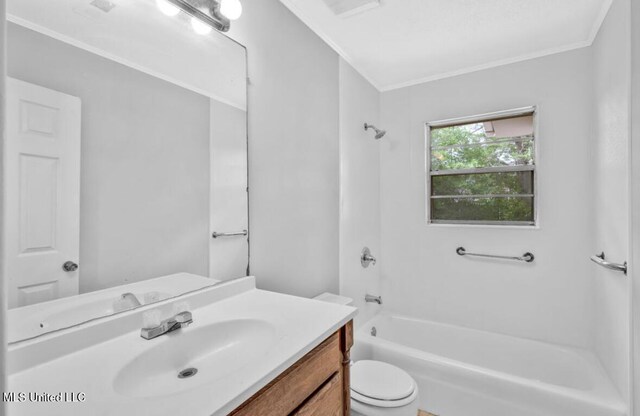 bathroom featuring vanity, toilet, crown molding, visible vents, and tub / shower combination