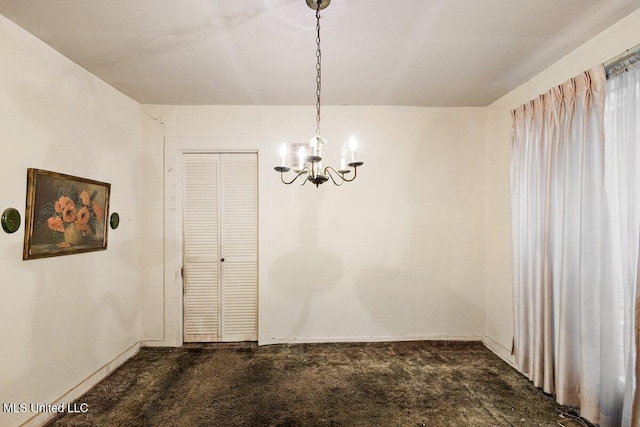 unfurnished dining area with dark carpet and an inviting chandelier