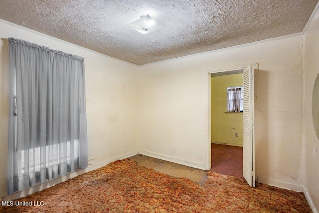 518 W Ash St, Jackson, MS 39203 - spare room featuring a textured ceiling and baseboards